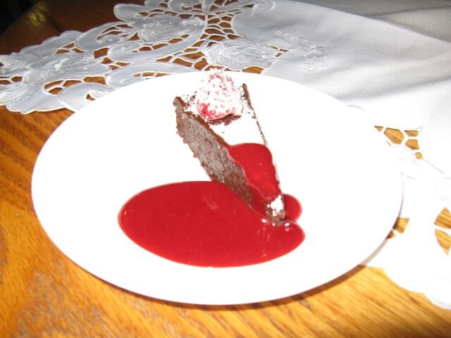 photo of 411's Raspberry Black Satin Fudge Cake With Raspberry Sauce