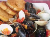 Little Neck Clams And Mussels In A Spicy Broth