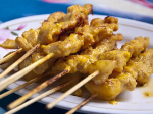 recipe for yellow curry marinated chicken satay and spicy peanut sauce