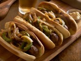 Grilled Bratwurst With Spicy Mesquite Peppers And Onions