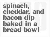 recipe for spinach, cheddar, and bacon dip baked in a bread bowl